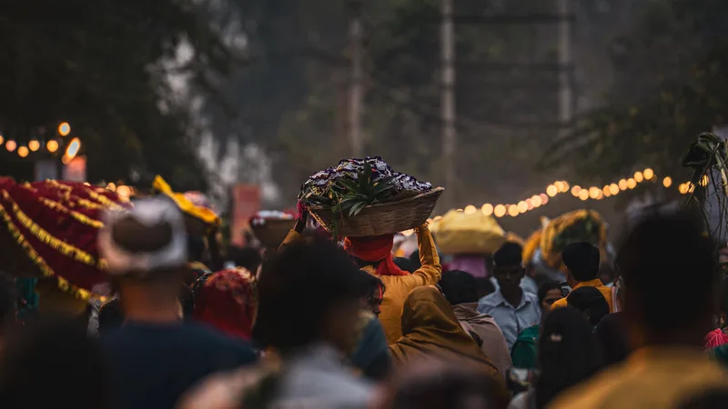 A busy flower market beneath warm strings of lights